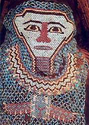 A bearded net cover showing the mummy's facial features