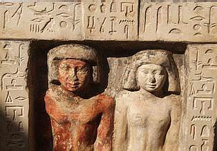 An ancient stone statue of the deceased Meri, left, and his wife, found at a tomb with ancient wooden coffins dating back to the 26th Pharaoh Dynasty that ruled from 672 BC to 525 BC, seen in Sakkara Wednesday, March 2, 2005, 10 kilometers south of Cairo. Australian archaeologists have discovered one of the best preserved ancient Egyptian mummies dating from about 2,600 years ago, Zahi Hawass, the head of Egypt's Supreme Council for Antiquities said .(AP Photo/Amr Nabil)