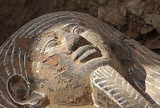 The face of an ancient wooden coffin, shaped like a human body that dates back to the 26th Pharaoh Dynasty that ruled from 672 BC to 525 BC, is seen in Sakkara, south of Cairo Wednesday, March 2, 2005. Australian archaeologists have discovered one of the best preserved ancient Egyptian mummies dating from about 2,600 years ago, Zahi Hawass, the head of Egypt's Supreme Council for Antiquities said.(AP Photo/Amr Nabil)